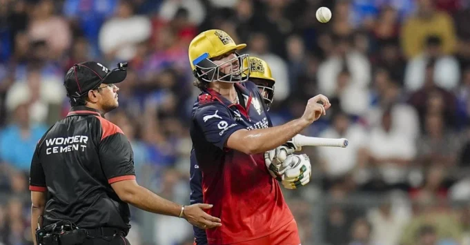 RCB-batter-Tim-David-penalized-for-his-actions-during-IPL-2026-clash-against-MI.webp.webp